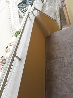 a staircase in a house with yellow walls at Apartmani 