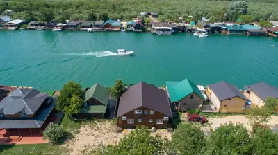 an aerial view of a small village on a lake at Hakuna Matata Apartments in Ulcinj