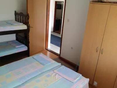 a room with two bunk beds and a mirror at Apartman Tripkovic in Bar