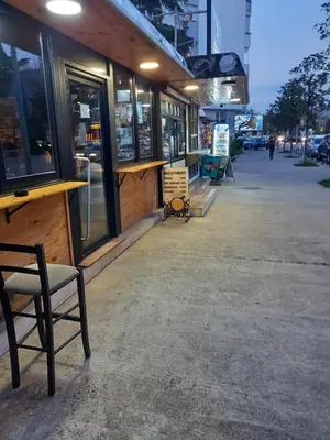 a chair sitting in front of a building at Apartment Podgorica centre in Podgorica