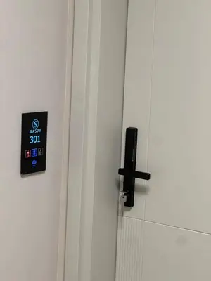 a close up of a door with a clock on it at Sea Star Apartments in Ulcinj