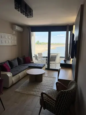 a living room with a couch and a table at Sea Star Apartments in Ulcinj