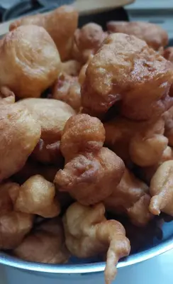 a pile of fried food on a blue plate at Boutique Home Saltaragazza in Petrovac na Moru