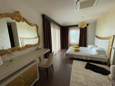 a bedroom with a bed and a large mirror at Luxury Villa Crystal Blue in Sveti Stefan