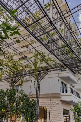 a large metal structure in front of a building at Hotel Pharos in Bar