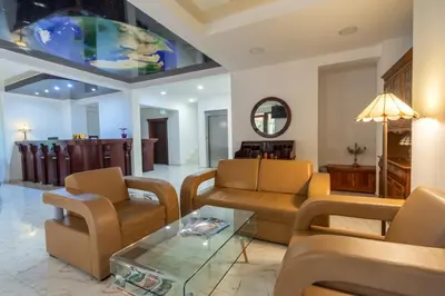 a living room with couches and a table at Hotel Pharos in Bar