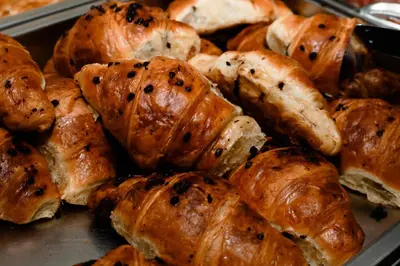 a pile of pastries in a tray at Hotel Pharos in Bar