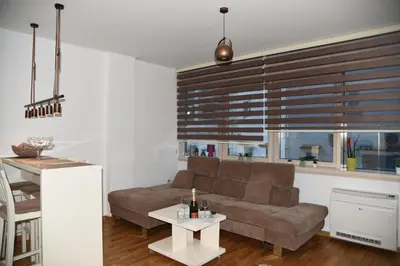 a living room with a couch and a table at Apartment Lux Fontana in Budva