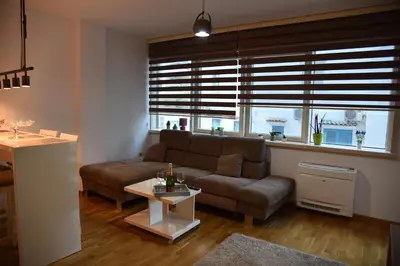 a living room with a couch and a table at Apartment Lux Fontana in Budva