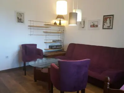 a living room with a couch and a table and chairs at Villa Marko in Sutomore