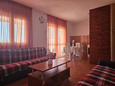 a living room with a couch and a table at Apartmani Vujicic in Bar