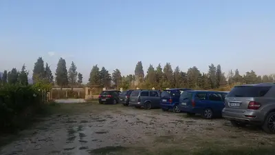 a row of cars parked in a parking lot at Rooms Ajllin in Ulcinj