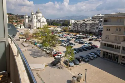 an aerial view of a parking lot in a city at Apartments 28 in Podgorica