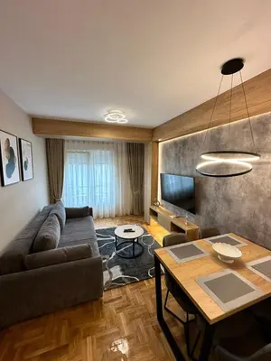 a living room with a couch and a table at Apartments 28 in Podgorica