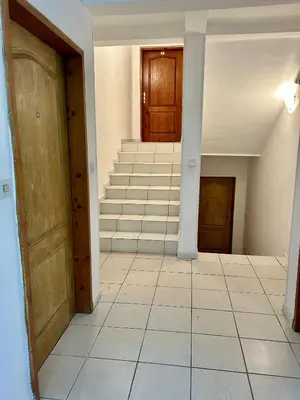 an empty hallway with stairs in a house at Studio Lucica in Petrovac na Moru