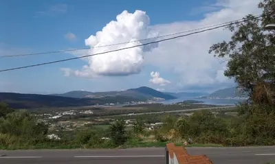 a view of a road and a body of water at Guest house Vila Vedesa in Kotor