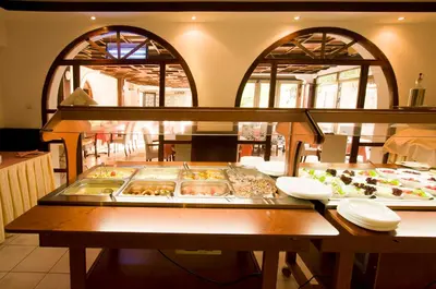 a buffet line with many different types of donuts at Vila Đurić - Ex Hotel Đurić in Petrovac na Moru