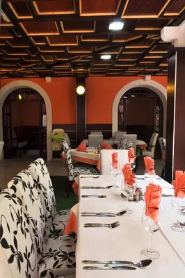 a dining room with a long table and chairs at Vila Đurić - Ex Hotel Đurić in Petrovac na Moru
