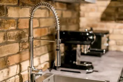a kitchen sink with a faucet on top of a sink at Apartments Magic Sea View in Kotor