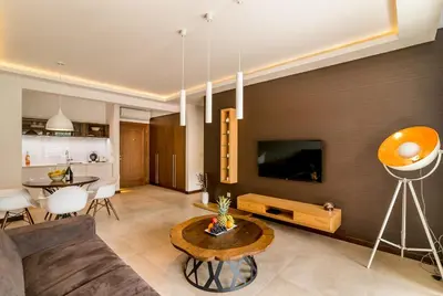 a living room with a couch and a tv at Apartments Magic Sea View in Kotor