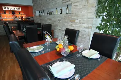a table with wine glasses and fruit on it at Accommodation Dolcino in Ulcinj