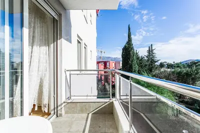 an apartment balcony with a view of the city at Apartments LORA Cetinjska in Budva
