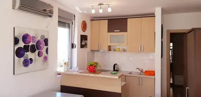 a kitchen with a sink and a counter top at Pjerotic Apartment in Budva
