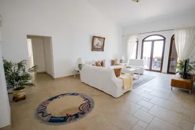 a living room with a white couch and a table at Luxury Villa Alena in Utjeha