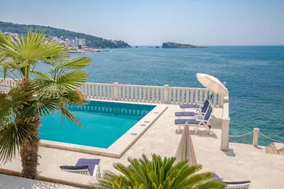 a swimming pool with a view of the ocean at Luxury Villa Alena in Utjeha
