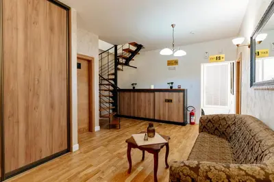 a living room with a couch and a table at Bofima Apartments in Kotor