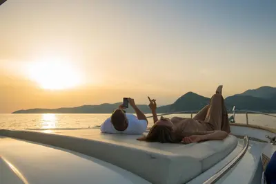 a group of people laying on the back of a boat at La Villa Boutique Hotel in Budva
