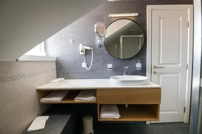 a bathroom with a sink and a mirror at La Villa Boutique Hotel in Budva