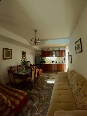 a living room with a couch and a table at Olga Bashinskaya in Sutomore