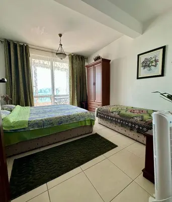 a bedroom with two beds and a window at Olga Bashinskaya in Sutomore