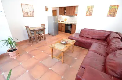 a living room with a couch and a table at Maritimo Apartments in Kotor
