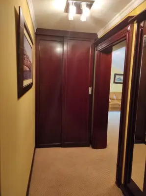 a hallway with a wooden door in a room at Hotel Mimoza in Budva