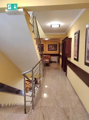 a staircase in a room with a stair case at Hotel Mimoza in Budva