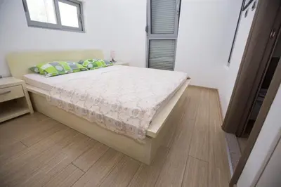 a bedroom with a bed in a room at Sea view Apartments Panorama Przno in Sveti Stefan