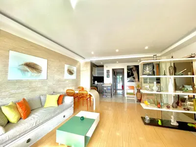 a living room with a couch and a table at Sea view Apartments Panorama Przno in Sveti Stefan
