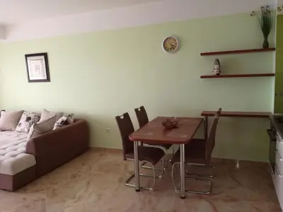 a living room with a couch and a table at Apartment Sea Space 3 in Dobra Voda