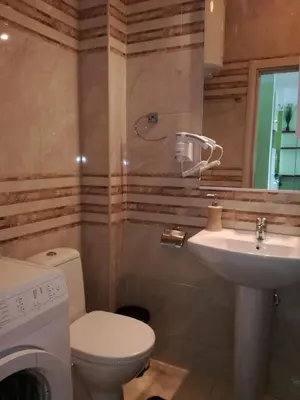 a bathroom with a toilet and a sink at Apartment Sea Space 3 in Dobra Voda