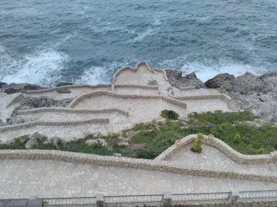 a staircase leading to the ocean with the waves at Apartment Sea Space 3 in Dobra Voda