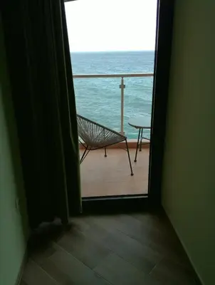 a room with a view of the ocean through a door at Apartment Sea Space 3 in Dobra Voda