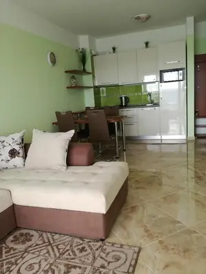 a living room with a bed and a kitchen at Apartment Sea Space 3 in Dobra Voda