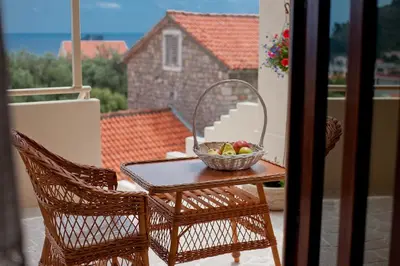 a bowl of fruit on a table on a balcony at Medin di Lastua in Petrovac na Moru