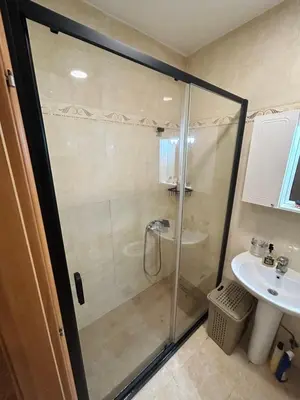 a bathroom with a shower and a sink at Apartment Flat in Podgorica