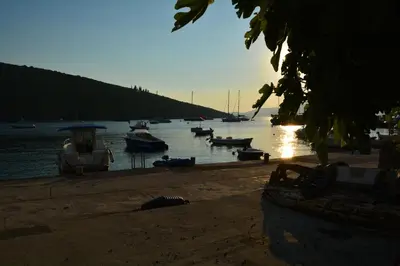 a group of boats sitting on the water at Apartments Bigovo Veljic in Tivat