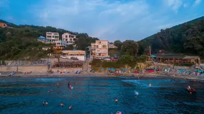 a group of people in the water at a beach at Casa Mila apartments & bungalows in Ulcinj