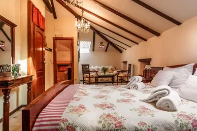 a bedroom with a large bed with towels on it at Hotel Monte Cristo in Kotor