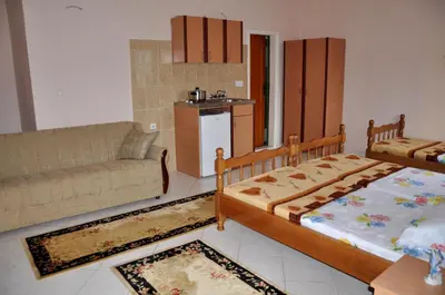 a living room with a bed and a couch at Apartments Perezaj in Ulcinj